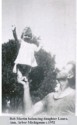 Bob Martin balancing daughter Laura,<br /> Ann, Arbor Michiganm c.1952