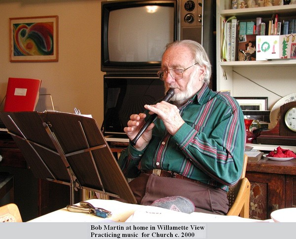 Bob Martin at home in Willamette View<br /> Practicing music  for Church c. 2000