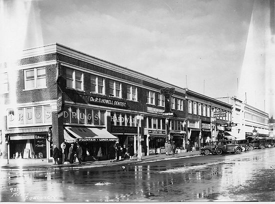 This photo shows both the Barnes building, (on the corner with the Drug store and hardware store in it), and the Lotus Building adjoining it with contiguous brick and terra cotta work.