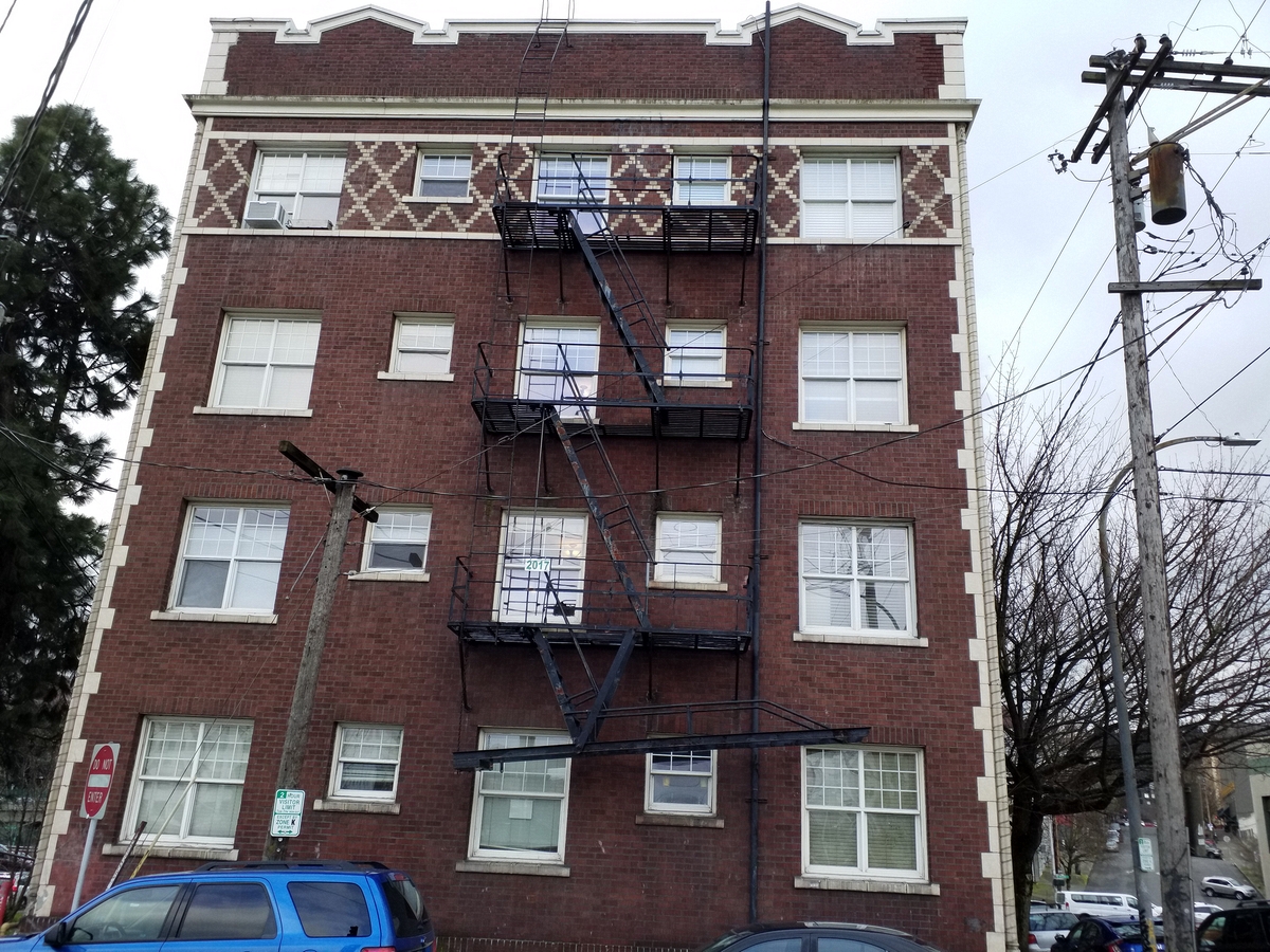 Photo taken Feb. 2018 of the north end of the Empress Apartments Hotel.  Built in 1926 at 16th and Washington.  Current Address in 2017 is 1539-1541 W Burnside. Order #165 Glaze #22M in Leonard Martins order book for Columbia Terra Cotta Co.  The name of the hotel was for a period of time "Marquette Manor"