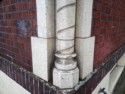 Photo taken Feb. 2018. Base of twisted Column detail at the NW corner of the Empress Apartments Hotel.  Built in 1926 at 16th and Washington.  Current Address in 2017 is 1539-1541 W Burnside. Order #165 Glaze #22M in Leonard Martins order book for Columbia Terra Cotta Co.  The name of the hotel was for a period of time "Marquette Manor"