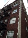 Photo taken Feb. 2018. Twisted column at the NW corner of the Empress Apartments Hotel.  Built in 1926 at 16th and Washington.  Current Address in 2017 is 1539-1541 W Burnside. Order #165 Glaze #22M in Leonard Martins order book for Columbia Terra Cotta Co.  The name of the hotel was for a period of time "Marquette Manor"