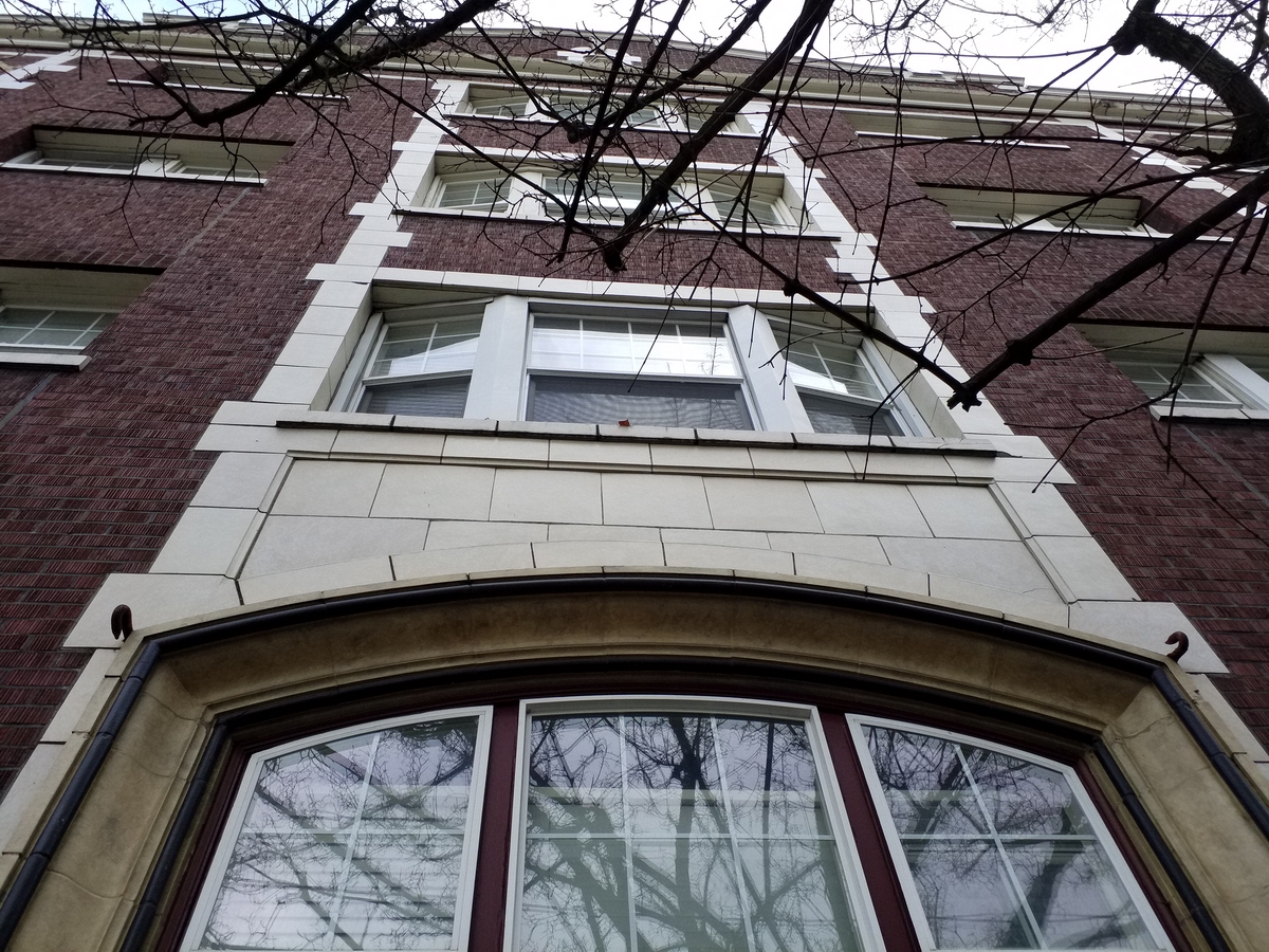 Photo taken Feb. 2018. West side above the main entrance of the Empress Apartments Hotel. The name of the hotel was for a period of time "Marquette Manor".  Built in 1926 at 16th and Washington.  Current Address in 2017 is 1539-1541 W Burnside. Order #165 Glaze #22M in Leonard Martins order book for Columbia Terra Cotta Co.  The terra cotta trim around the entrance that is more of a yellowish color appears to be painted.