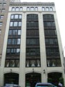 The Holland Building now known as the Miken Building as shown here in 2017 is  located mid-block on the west side of Fourth Avenue  between Union and Pike Streets in Seattle Wa., this  eight-story office building was designed and constructed in two phases with the initial four floors built in 1918 and the upper four floors added in 1923. It is assumed that the building was built and expanded for The Exeter Company. The 1923 addition was constructed according to plans prepared by architects Stuart and Wheatley.  In L.A. Martins Order book for the Columbia Terra Cotta it is order #102 Glaze 99, the Holland Building Seattle Wa. Arcitects Stewart+Wheatley.  According to an article July 7th, 1923 in the Vancouver Columbian: "With 40 percent of the moulds necessary for their first contract already completed,, work at the Columbia Terra Cotta Company plant, at the foot of west 13th street is progressing so rapidly that Manager M. L. Bryan declared today his company expects to start burning its first kiln of terra cotta by the latter part of the week. ... The job consists of all the terra cotta work for the eight-story Holland building now under construction at Fourth avenue and Pike street in Seattle. ... Bryan says "it si a good contract and, with the exception of a few pieces, the design is not particularly complicated ..." ..."The contract specifies cream colored, glazed terra cotta.  The contract specifies the first delivery must begin by September 22 ..."