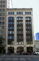 The Holland Building now known as the Miken Building as shown here in 2017 is  located mid-block on the west side of Fourth Avenue  between Union and Pike Streets in Seattle Wa., this  eight-story office building was designed and constructed in two phases with the initial four floors built in 1918 and the upper four floors added in 1923. It is assumed that the building was built and expanded for The Exeter Company. The 1923 addition was constructed according to plans prepared by architects Stuart and Wheatley.  In L.A. Martins Order book for the Columbia Terra Cotta it is order #102 Glaze 99, the Holland Building Seattle Wa. Arcitects Stewart+Wheatley.  According to an article July 7th, 1923 in the Vancouver Columbian: "With 40 percent of the moulds necessary for their first contract already completed,, work at the Columbia Terra Cotta Company plant, at the foot of west 13th street is progressing so rapidly that Manager M. L. Bryan declared today his company expects to start burning its first kiln of terra cotta by the latter part of the week. ... The job consists of all the terra cotta work for the eight-story Holland building now under construction at Fourth avenue and Pike street in Seattle. ... Bryan says "it si a good contract and, with the exception of a few pieces, the design is not particularly complicated ..." ..."The contract specifies cream colored, glazed terra cotta.  The contract specifies the first delivery must begin by September 22 ..."