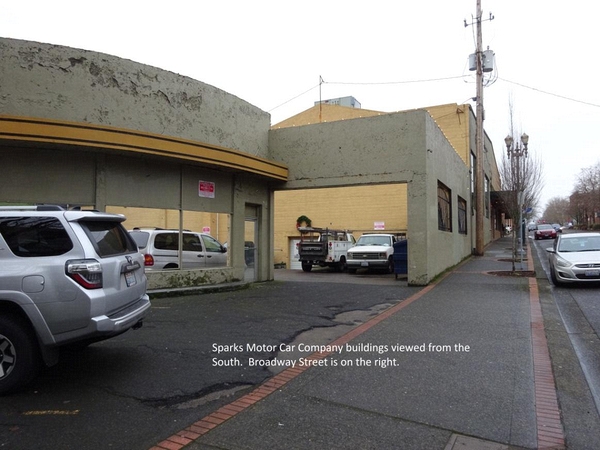 Sparks Motor Car Company\nEntries in Polks City Directories indicate that the Sparks family operated a Dodge/Plymouth dealership and garage in Vancouver from as early as 1928 and as late as 1950.  The business occupied multiple building that were located on Broadway between 6th and 7th Streets.  These may have been built at different times.  The business was also listed in numerous advertisements in The Oregonian between 1923 and the early 1950s.\nNotes:\n1920 census shows Clay Sparks as clerk in hardware store.  Living w/parents, Marshall and Alice\n1928 City Directory shows Sparks Motor Car Co. at E. 7th and Broadway\n1930 census shows Leslie C. Sparks working at Auto Company\n1931 City Directory shows Sparks Motor Car Co. at 115 E 7th\n1934 and 35 Oregonian Ads for Dodge Autos show Sparks at 115 E 7th and also in Longview/Kelso\n1940 Census shows Clay Sparks as owner of Sparks Motor Car Co. \n1941 and 1950 Oregonian Ads show Sparks Motor Car Company at E 6th and Broadway\n1942 WW-II Draft Registration: Leslie Clay Sparks was born Feb 24, 1890 in Vancouver.  Self employed at Sparks Motor Co.  115 E 7th.\n1955 Apr 6, Leslie Clay Sparks died at 69 yrs\nBy 1960, the Dodge dealership in Vancouver has transferred to the Hannah Family but the Sparks appear to still own the one in Kelso.\nIn 1995, a fire gutted the southerly building where an auto body shop was located.  The concrete shell remains today, but the building has never been rebuilt.